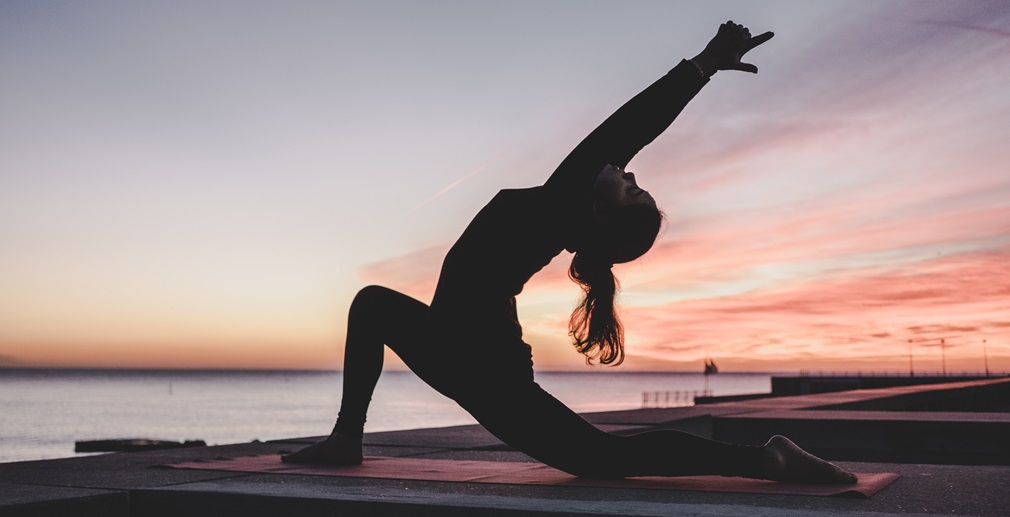 a woman performing yoga